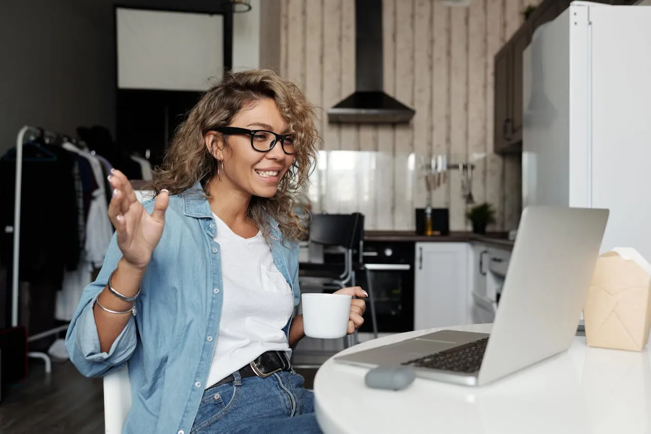 Happy woman using a laptop for a video call